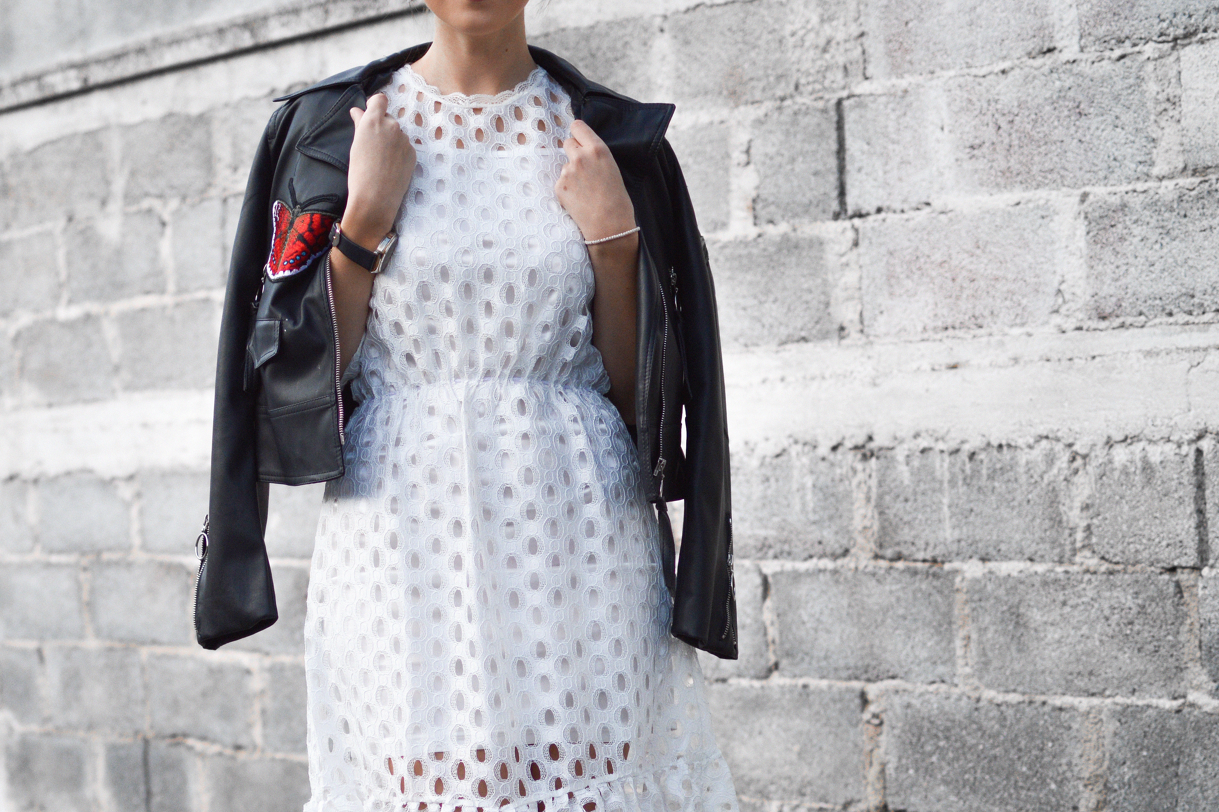 Classic Ways to Style an All-White Outfit with a black moto jacket
